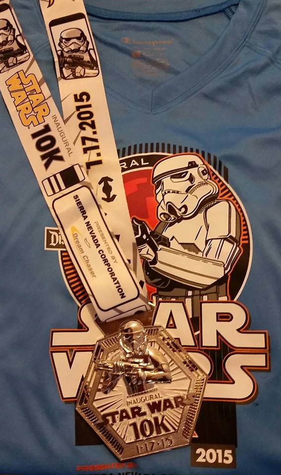 Inaugural runDisney Star Wars 10k finishers medal and tech shirt.