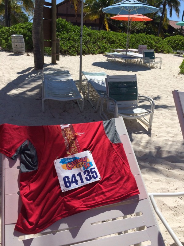 A photo of my race bib from the Castaway Cay 5K on the beach