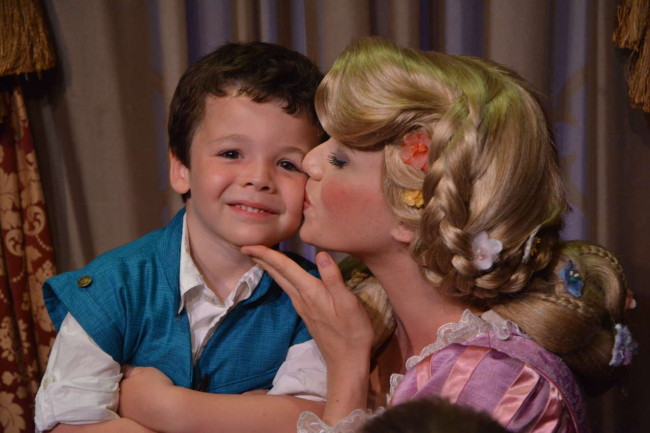 My tiny prince gets a kiss from his favorite Disney princess!