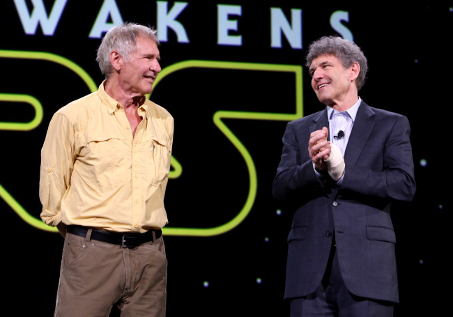 ANAHEIM, CA - AUGUST 15:  Actor Harrison Ford of STAR WARS: THE FORCE AWAKENS (L) and Chairman of the Walt Disney Studios Alan Horn took part today in "Worlds, Galaxies, and Universes: Live Action at The Walt Disney Studios" presentation at Disney's D23 EXPO 2015 in Anaheim, Calif.  (Photo by Jesse Grant/Getty Images for Disney) *** Local Caption *** Harrison Ford; Alan Horn