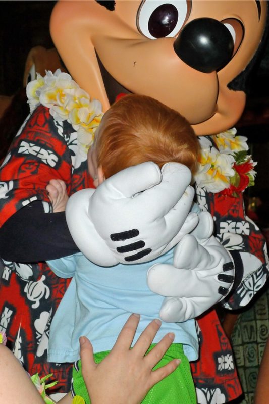 Baby Meeting Mickey Mouse for the First Time. 