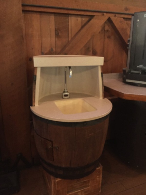 Washing Station that resembles hollowed out barrel